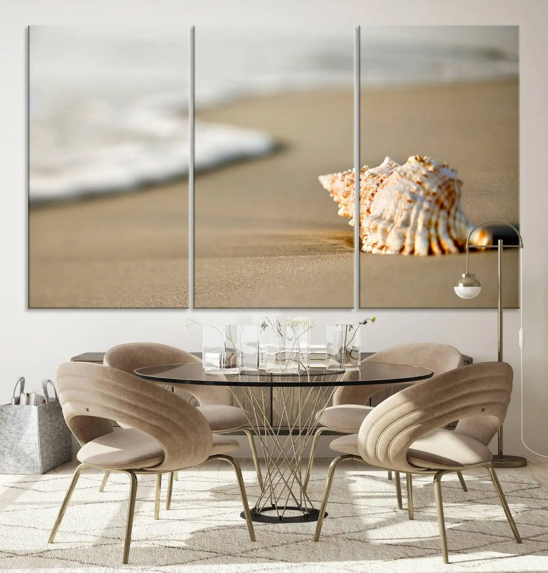 The triptych artwork titled "Sea Shell on the Beach Canvas Wall Art Beach Canvas Print" showcases a seashell on a sandy beach with ocean waves in the background, creating a stunning piece of coastal wall decor.