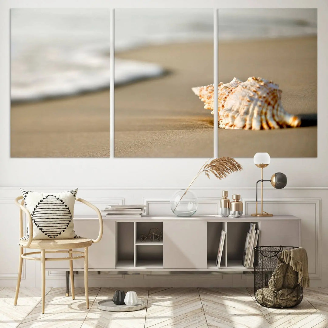 The triptych artwork titled "Sea Shell on the Beach Canvas Wall Art Beach Canvas Print" showcases a seashell on a sandy beach with ocean waves in the background, creating a stunning piece of coastal wall decor.