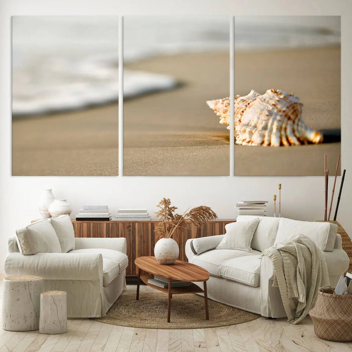 The triptych artwork titled "Sea Shell on the Beach Canvas Wall Art Beach Canvas Print" showcases a seashell on a sandy beach with ocean waves in the background, creating a stunning piece of coastal wall decor.