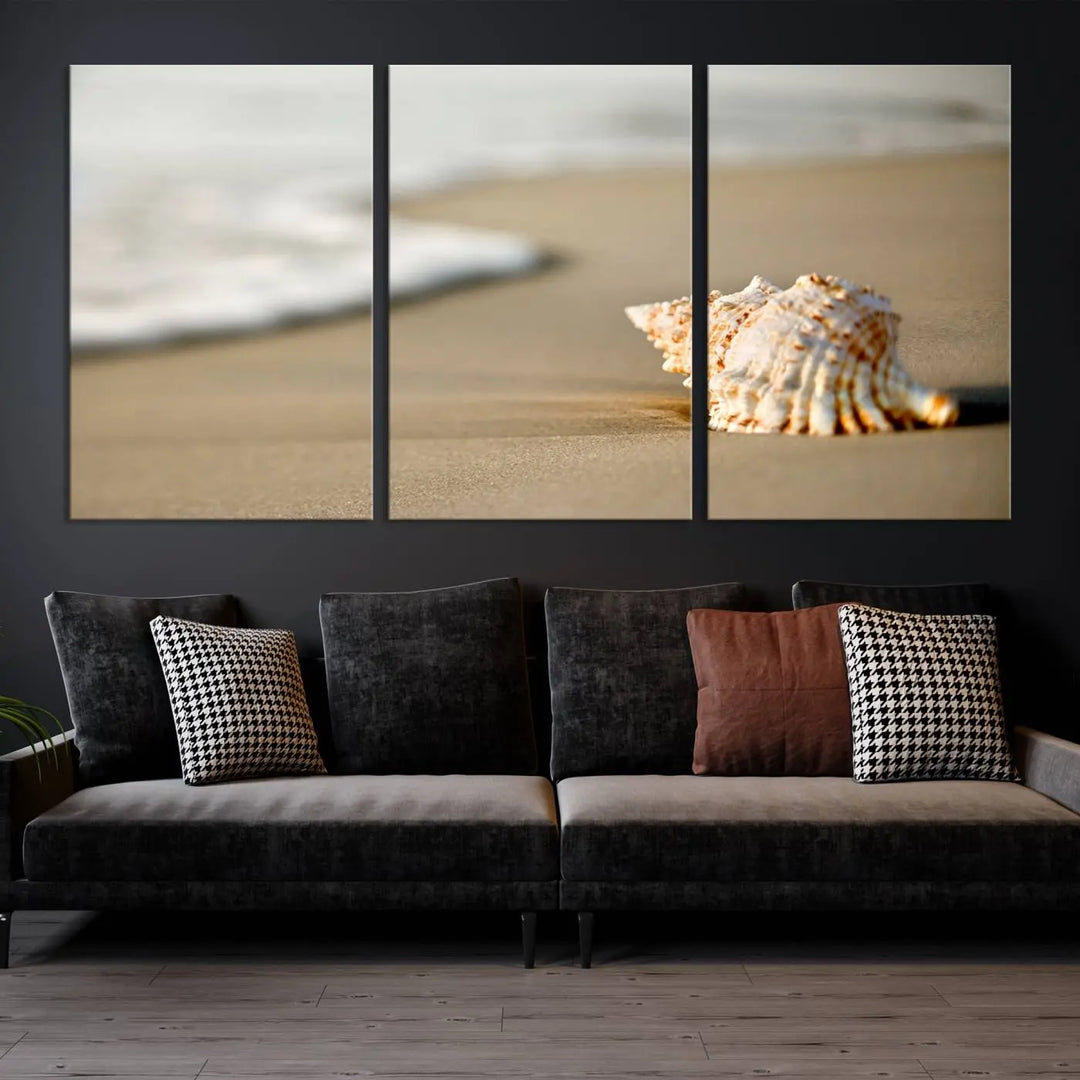 The triptych artwork titled "Sea Shell on the Beach Canvas Wall Art Beach Canvas Print" showcases a seashell on a sandy beach with ocean waves in the background, creating a stunning piece of coastal wall decor.