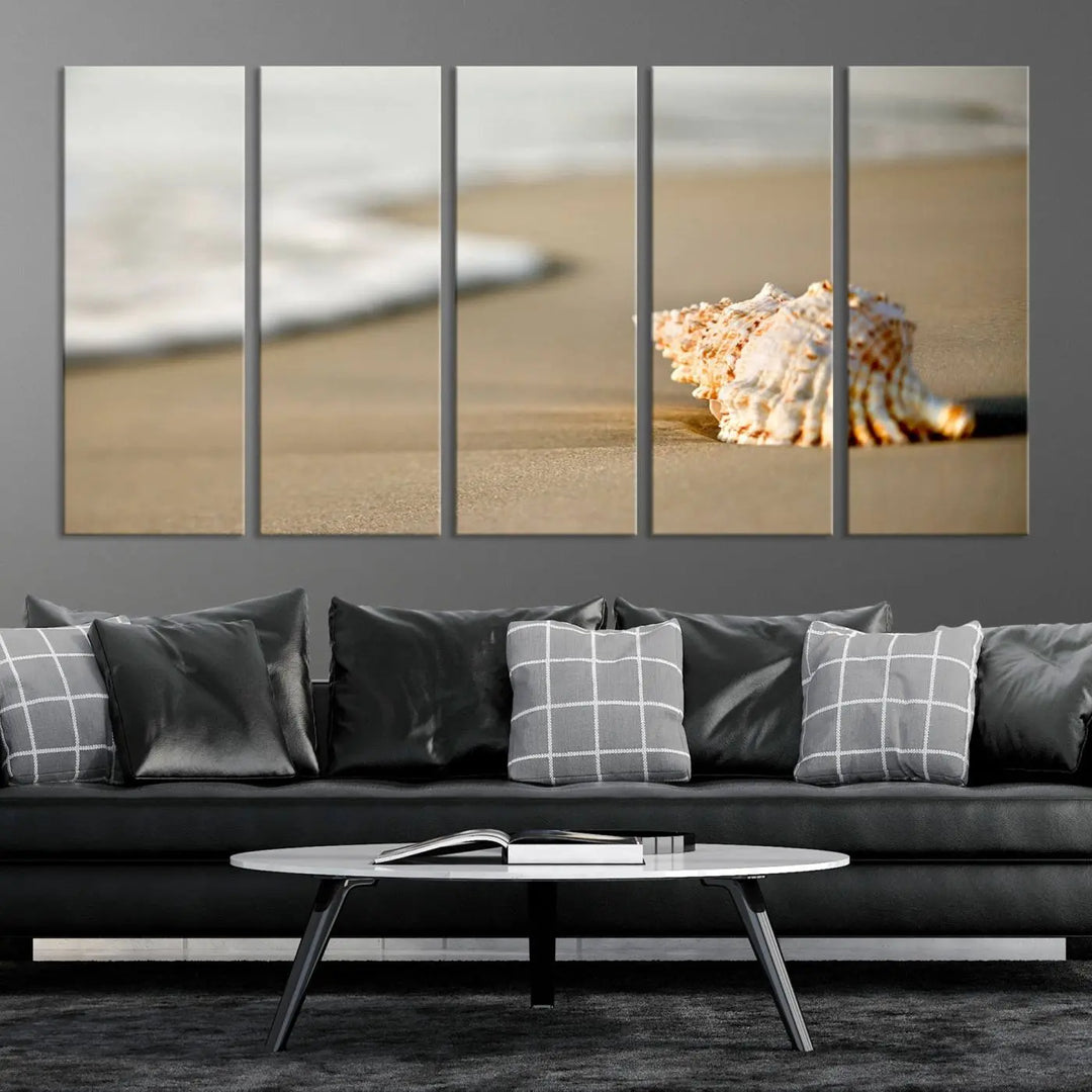 The triptych artwork titled "Sea Shell on the Beach Canvas Wall Art Beach Canvas Print" showcases a seashell on a sandy beach with ocean waves in the background, creating a stunning piece of coastal wall decor.