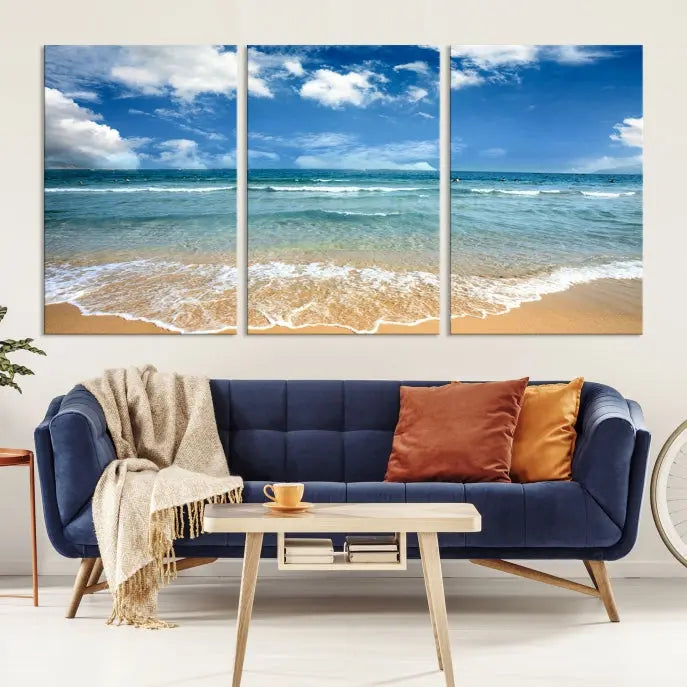 The "Sea View From the Beach Canvas Print" triptych adorns the wall. Each piece is printed on museum-quality canvas, ready to hang, and designed to preserve its vibrant colors with a UV-protective coating.