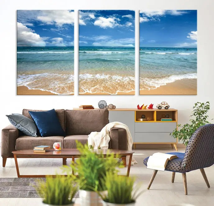 The "Sea View From the Beach Canvas Print" triptych adorns the wall. Each piece is printed on museum-quality canvas, ready to hang, and designed to preserve its vibrant colors with a UV-protective coating.