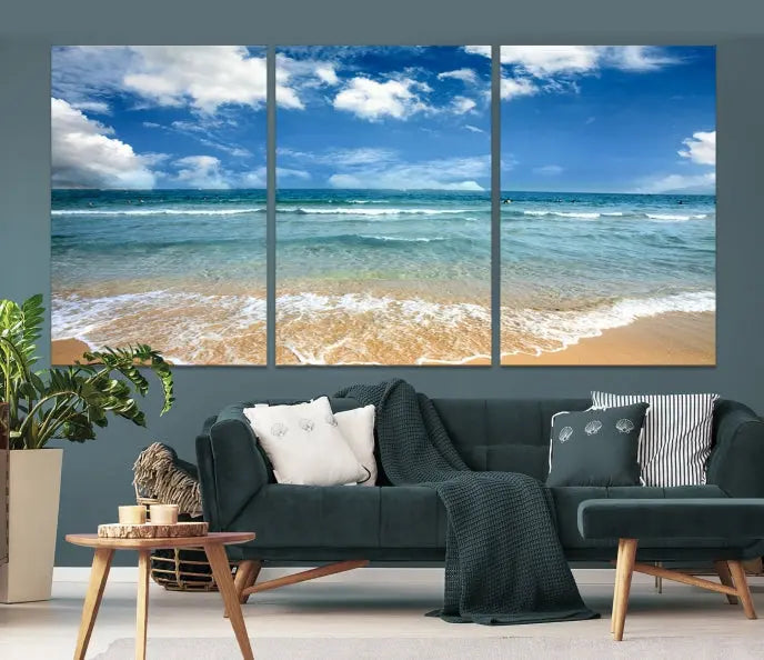 The "Sea View From the Beach Canvas Print" triptych adorns the wall. Each piece is printed on museum-quality canvas, ready to hang, and designed to preserve its vibrant colors with a UV-protective coating.