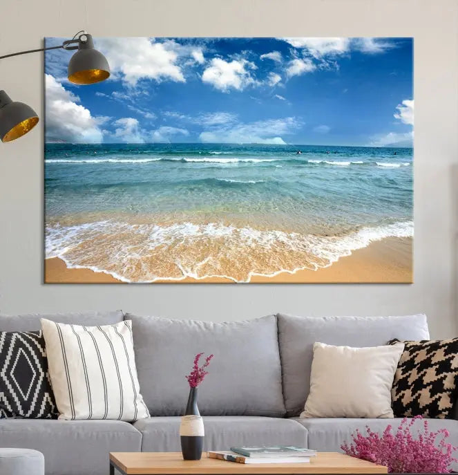 The "Sea View From the Beach Canvas Print" triptych adorns the wall. Each piece is printed on museum-quality canvas, ready to hang, and designed to preserve its vibrant colors with a UV-protective coating.