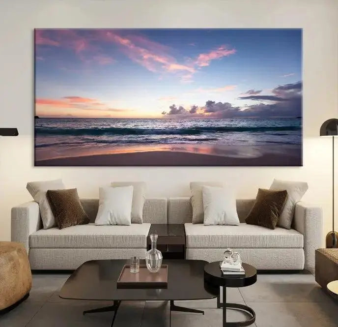 A triptych of the "Sea and Beach Wall Art Canvas Print" hangs elegantly in the modern living room. The gallery-wrapped artwork, printed on museum-quality canvas, is beautifully enhanced by its elegantly hand-assembled frame, adding an elegant touch to the space.