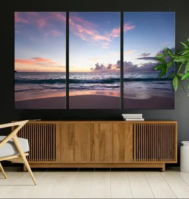 A triptych of the "Sea and Beach Wall Art Canvas Print" hangs elegantly in the modern living room. The gallery-wrapped artwork, printed on museum-quality canvas, is beautifully enhanced by its elegantly hand-assembled frame, adding an elegant touch to the space.