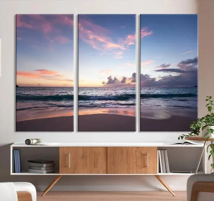 A triptych of the "Sea and Beach Wall Art Canvas Print" hangs elegantly in the modern living room. The gallery-wrapped artwork, printed on museum-quality canvas, is beautifully enhanced by its elegantly hand-assembled frame, adding an elegant touch to the space.