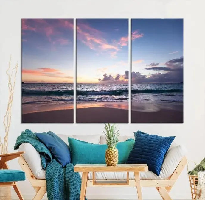 A triptych of the "Sea and Beach Wall Art Canvas Print" hangs elegantly in the modern living room. The gallery-wrapped artwork, printed on museum-quality canvas, is beautifully enhanced by its elegantly hand-assembled frame, adding an elegant touch to the space.