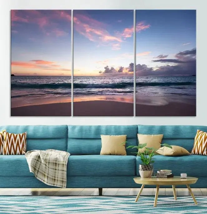 A triptych of the "Sea and Beach Wall Art Canvas Print" hangs elegantly in the modern living room. The gallery-wrapped artwork, printed on museum-quality canvas, is beautifully enhanced by its elegantly hand-assembled frame, adding an elegant touch to the space.