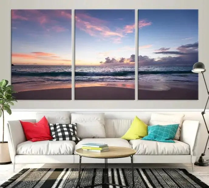 A triptych of the "Sea and Beach Wall Art Canvas Print" hangs elegantly in the modern living room. The gallery-wrapped artwork, printed on museum-quality canvas, is beautifully enhanced by its elegantly hand-assembled frame, adding an elegant touch to the space.