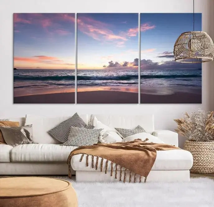 A triptych of the "Sea and Beach Wall Art Canvas Print" hangs elegantly in the modern living room. The gallery-wrapped artwork, printed on museum-quality canvas, is beautifully enhanced by its elegantly hand-assembled frame, adding an elegant touch to the space.