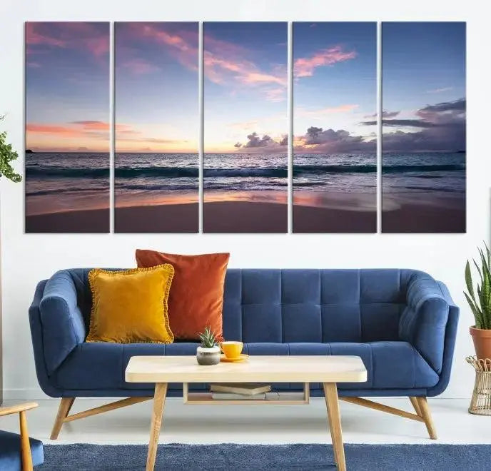 A triptych of the "Sea and Beach Wall Art Canvas Print" hangs elegantly in the modern living room. The gallery-wrapped artwork, printed on museum-quality canvas, is beautifully enhanced by its elegantly hand-assembled frame, adding an elegant touch to the space.