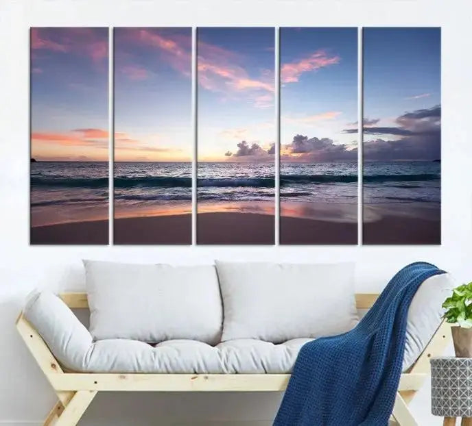 A triptych of the "Sea and Beach Wall Art Canvas Print" hangs elegantly in the modern living room. The gallery-wrapped artwork, printed on museum-quality canvas, is beautifully enhanced by its elegantly hand-assembled frame, adding an elegant touch to the space.