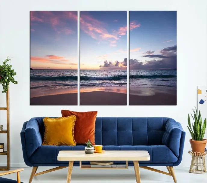 A triptych of the "Sea and Beach Wall Art Canvas Print" hangs elegantly in the modern living room. The gallery-wrapped artwork, printed on museum-quality canvas, is beautifully enhanced by its elegantly hand-assembled frame, adding an elegant touch to the space.