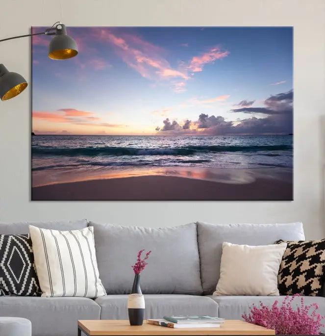 A triptych of the "Sea and Beach Wall Art Canvas Print" hangs elegantly in the modern living room. The gallery-wrapped artwork, printed on museum-quality canvas, is beautifully enhanced by its elegantly hand-assembled frame, adding an elegant touch to the space.