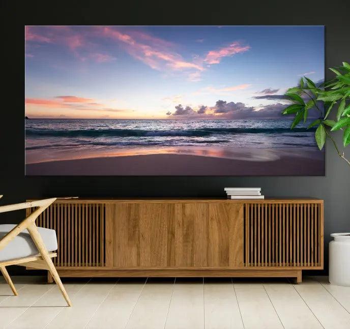 A triptych of the "Sea and Beach Wall Art Canvas Print" hangs elegantly in the modern living room. The gallery-wrapped artwork, printed on museum-quality canvas, is beautifully enhanced by its elegantly hand-assembled frame, adding an elegant touch to the space.