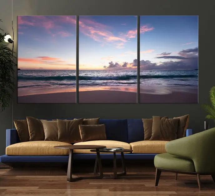 A triptych of the "Sea and Beach Wall Art Canvas Print" hangs elegantly in the modern living room. The gallery-wrapped artwork, printed on museum-quality canvas, is beautifully enhanced by its elegantly hand-assembled frame, adding an elegant touch to the space.