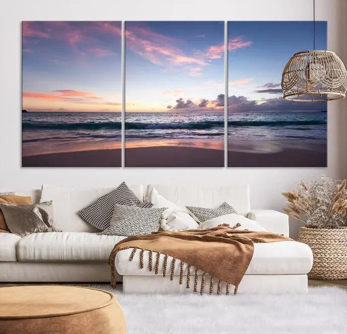 A triptych of the "Sea and Beach Wall Art Canvas Print" hangs elegantly in the modern living room. The gallery-wrapped artwork, printed on museum-quality canvas, is beautifully enhanced by its elegantly hand-assembled frame, adding an elegant touch to the space.