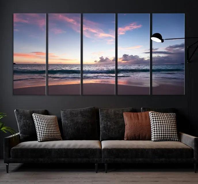 A triptych of the "Sea and Beach Wall Art Canvas Print" hangs elegantly in the modern living room. The gallery-wrapped artwork, printed on museum-quality canvas, is beautifully enhanced by its elegantly hand-assembled frame, adding an elegant touch to the space.