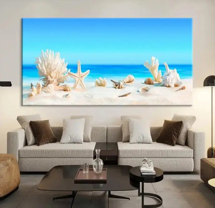 The Seashell Wall Art Canvas Print features a triptych of a beach scene, complete with coral, starfish, and seashells on sand. Printed on museum-quality canvas with UV-protective coating, it is ready to hang and brings vibrant charm to any living room.