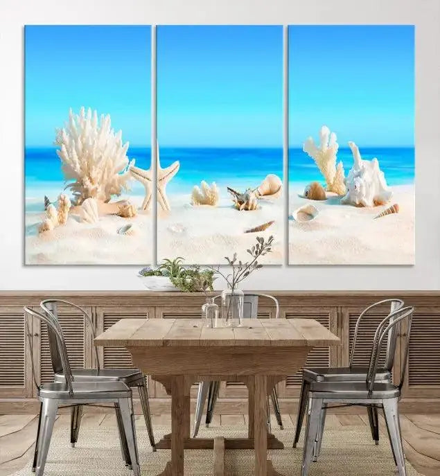 The Seashell Wall Art Canvas Print features a triptych of a beach scene, complete with coral, starfish, and seashells on sand. Printed on museum-quality canvas with UV-protective coating, it is ready to hang and brings vibrant charm to any living room.