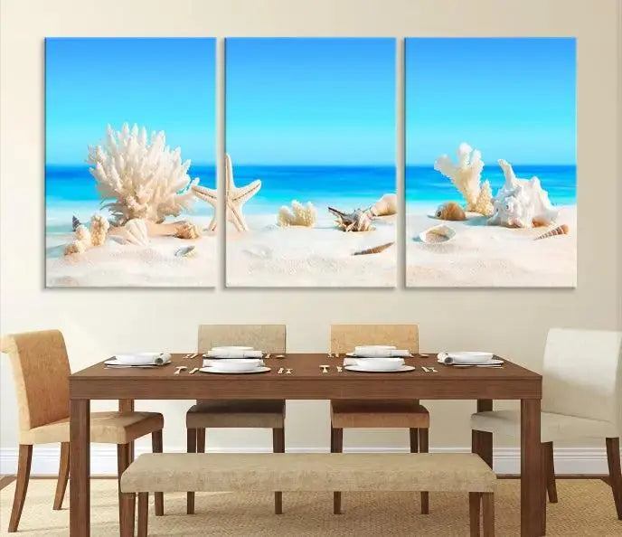 The Seashell Wall Art Canvas Print features a triptych of a beach scene, complete with coral, starfish, and seashells on sand. Printed on museum-quality canvas with UV-protective coating, it is ready to hang and brings vibrant charm to any living room.