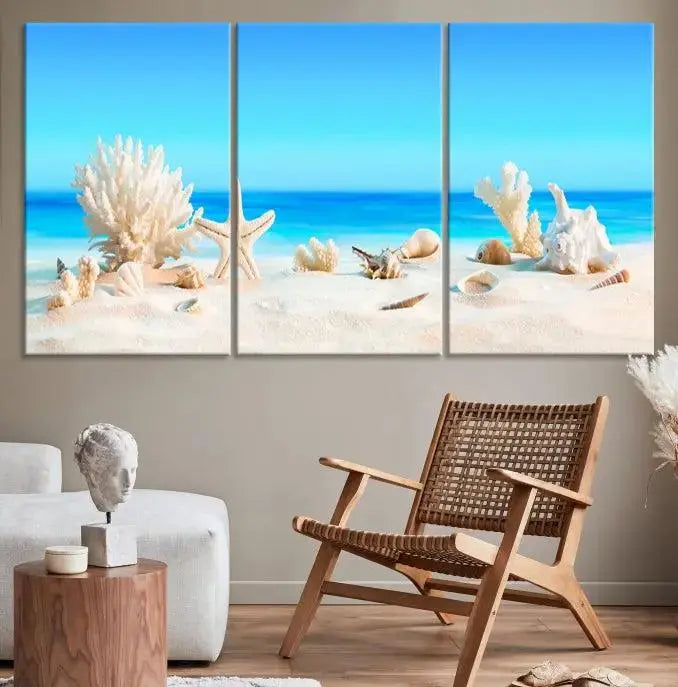 The Seashell Wall Art Canvas Print features a triptych of a beach scene, complete with coral, starfish, and seashells on sand. Printed on museum-quality canvas with UV-protective coating, it is ready to hang and brings vibrant charm to any living room.