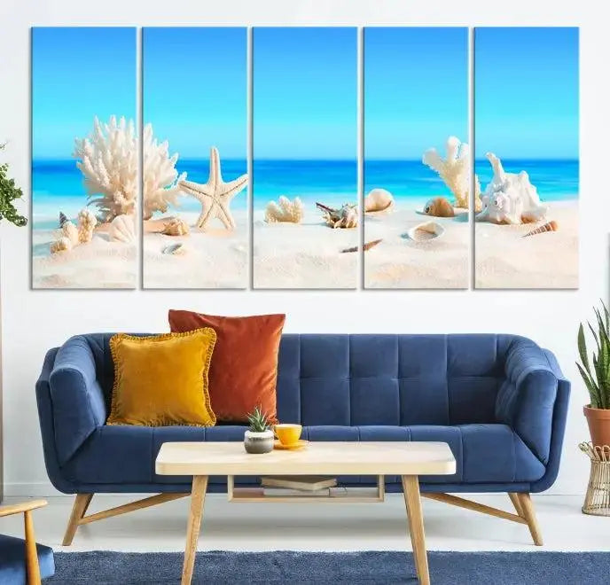 The Seashell Wall Art Canvas Print features a triptych of a beach scene, complete with coral, starfish, and seashells on sand. Printed on museum-quality canvas with UV-protective coating, it is ready to hang and brings vibrant charm to any living room.