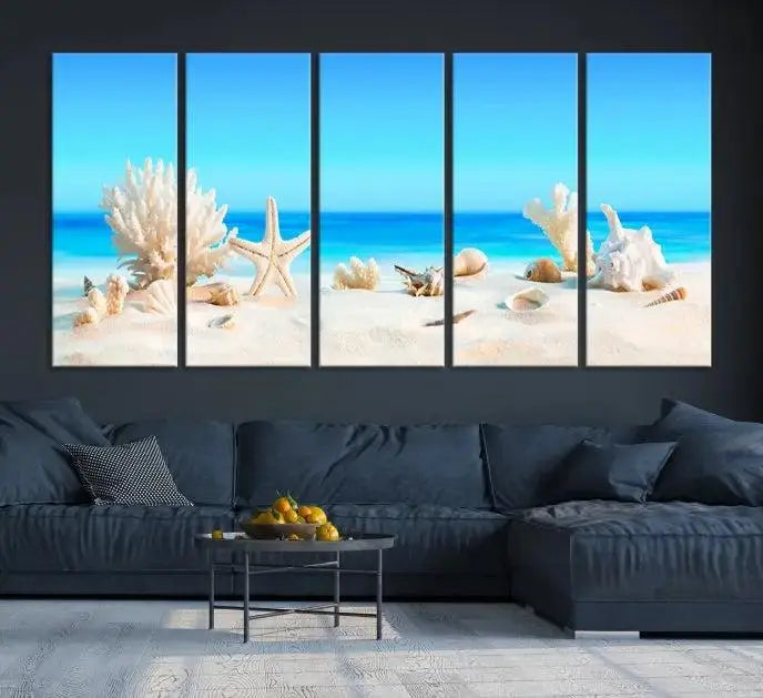 The Seashell Wall Art Canvas Print features a triptych of a beach scene, complete with coral, starfish, and seashells on sand. Printed on museum-quality canvas with UV-protective coating, it is ready to hang and brings vibrant charm to any living room.