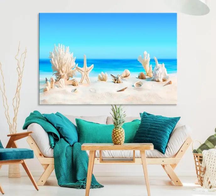 The Seashell Wall Art Canvas Print features a triptych of a beach scene, complete with coral, starfish, and seashells on sand. Printed on museum-quality canvas with UV-protective coating, it is ready to hang and brings vibrant charm to any living room.