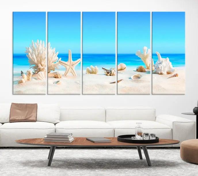 The Seashell Wall Art Canvas Print features a triptych of a beach scene, complete with coral, starfish, and seashells on sand. Printed on museum-quality canvas with UV-protective coating, it is ready to hang and brings vibrant charm to any living room.