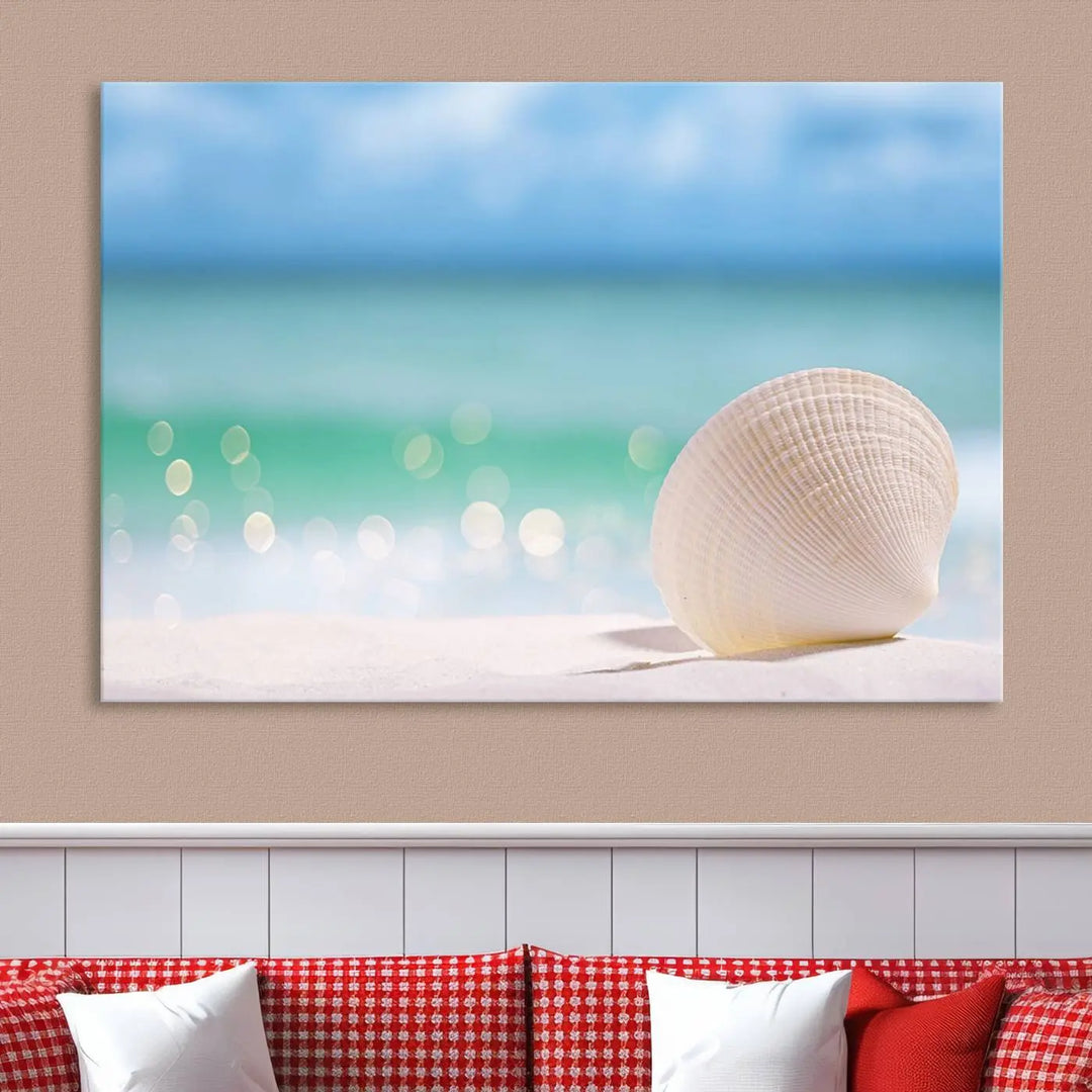 The "Seashell on The Beach Wall Art Canvas Print" features a triptych photo of a seashell on a sandy beach. This artwork is printed on gallery-wrapped, museum-quality canvas with a UV-protective coating.