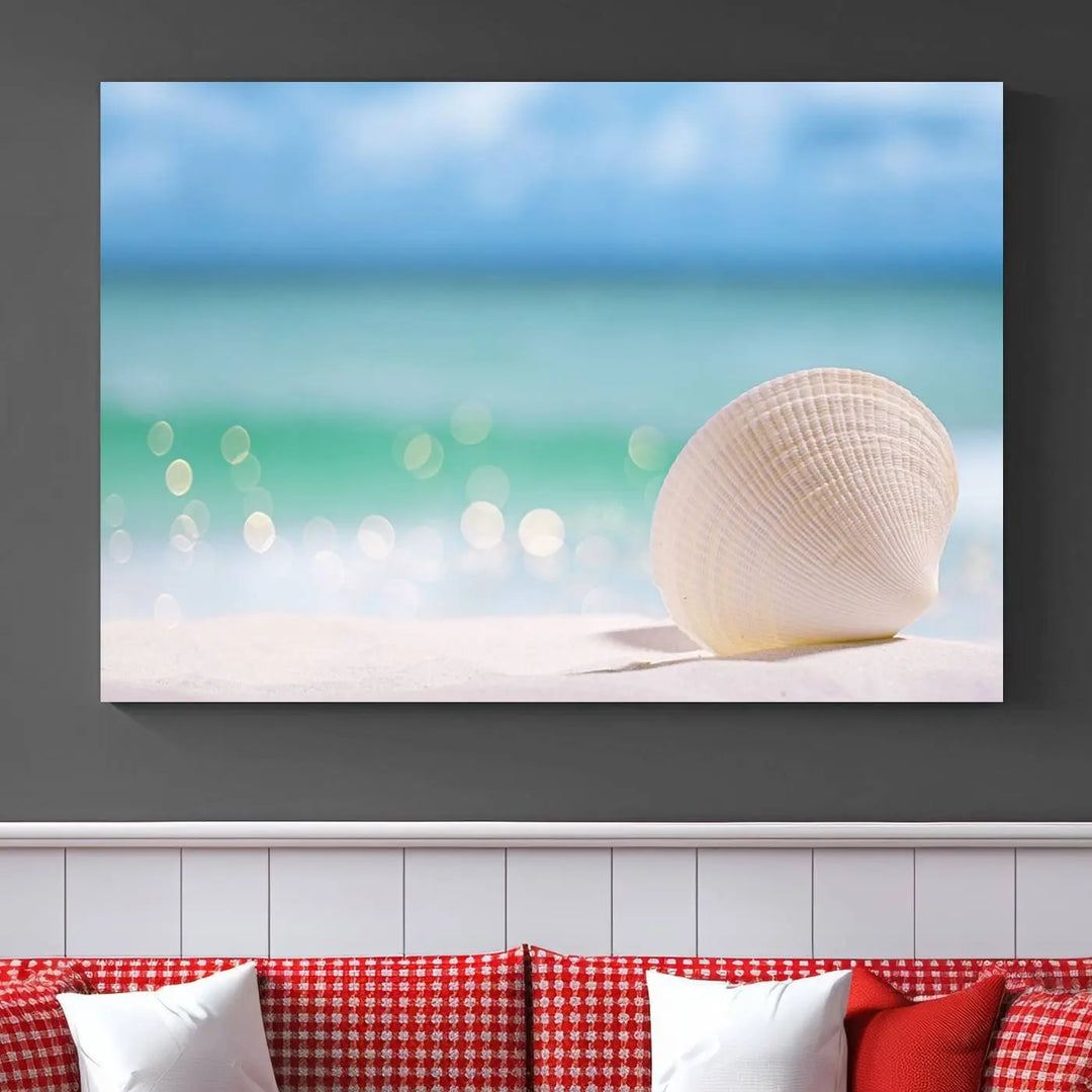 The "Seashell on The Beach Wall Art Canvas Print" features a triptych photo of a seashell on a sandy beach. This artwork is printed on gallery-wrapped, museum-quality canvas with a UV-protective coating.