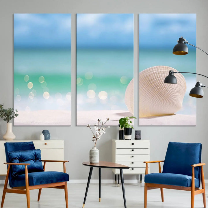 The "Seashell on The Beach Wall Art Canvas Print" features a triptych photo of a seashell on a sandy beach. This artwork is printed on gallery-wrapped, museum-quality canvas with a UV-protective coating.