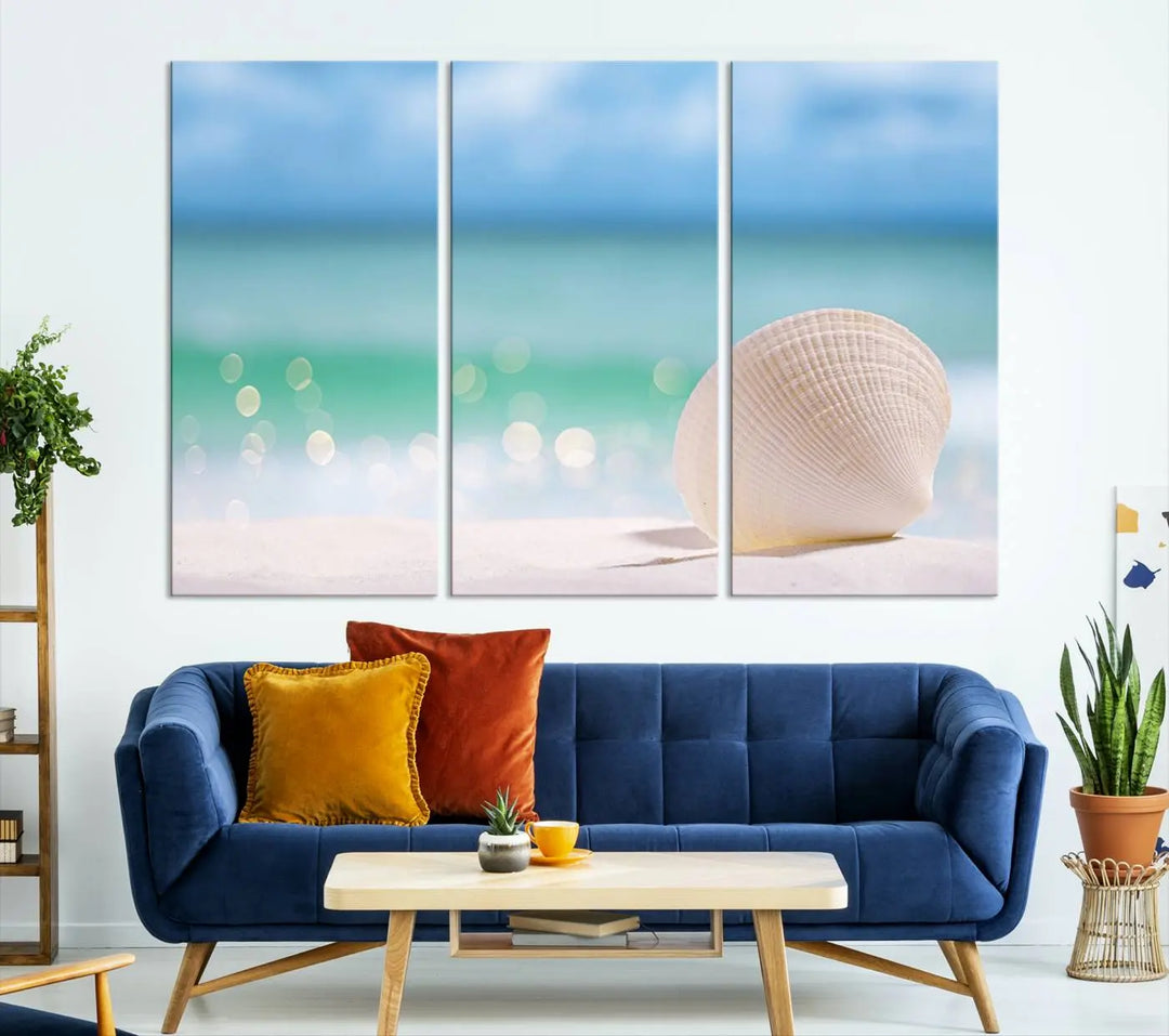 The "Seashell on The Beach Wall Art Canvas Print" features a triptych photo of a seashell on a sandy beach. This artwork is printed on gallery-wrapped, museum-quality canvas with a UV-protective coating.