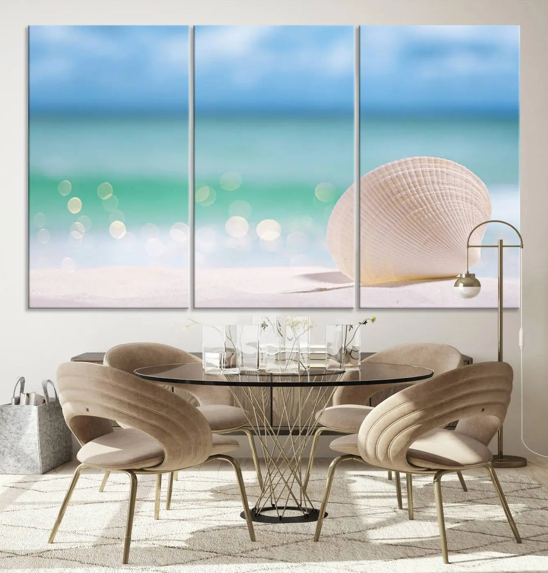 The "Seashell on The Beach Wall Art Canvas Print" features a triptych photo of a seashell on a sandy beach. This artwork is printed on gallery-wrapped, museum-quality canvas with a UV-protective coating.