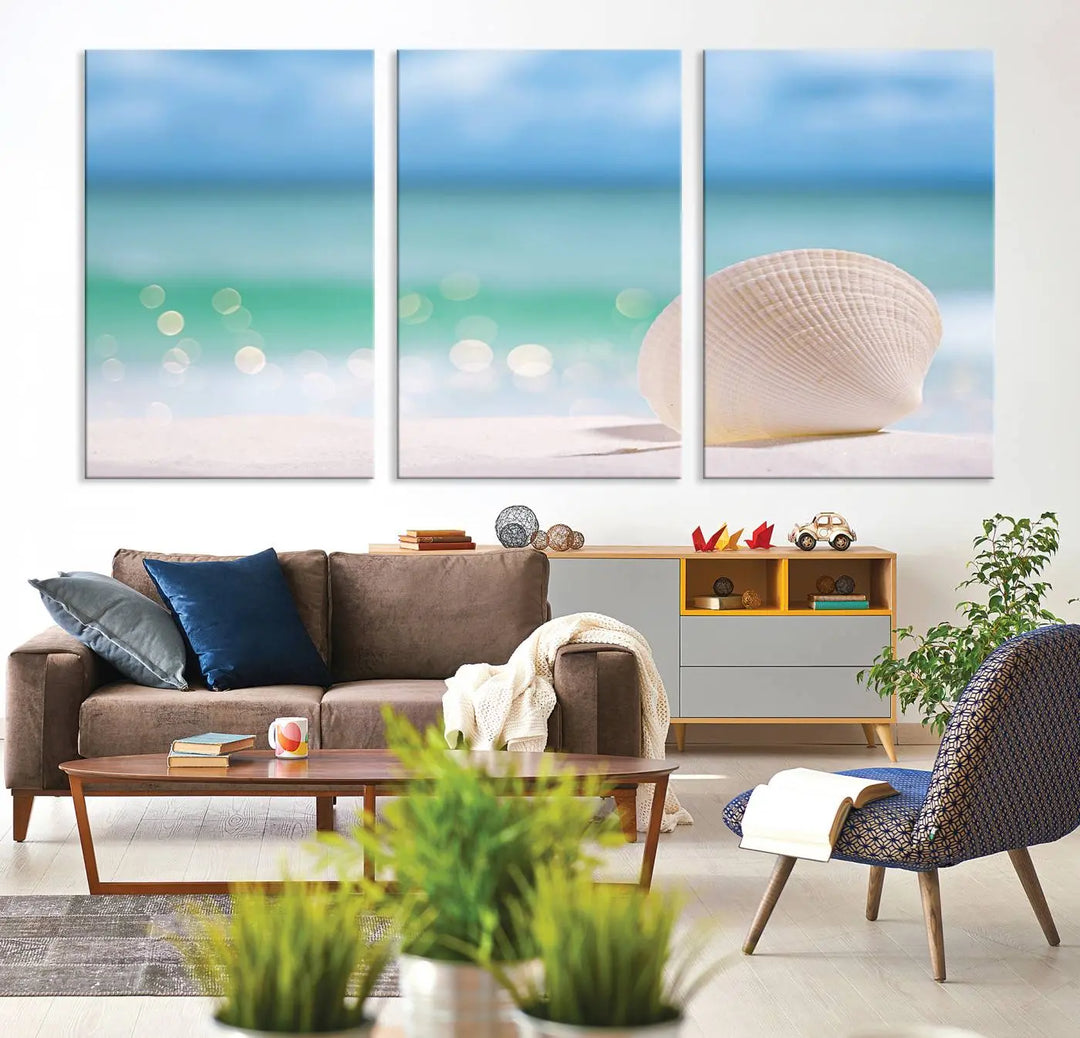 The "Seashell on The Beach Wall Art Canvas Print" features a triptych photo of a seashell on a sandy beach. This artwork is printed on gallery-wrapped, museum-quality canvas with a UV-protective coating.