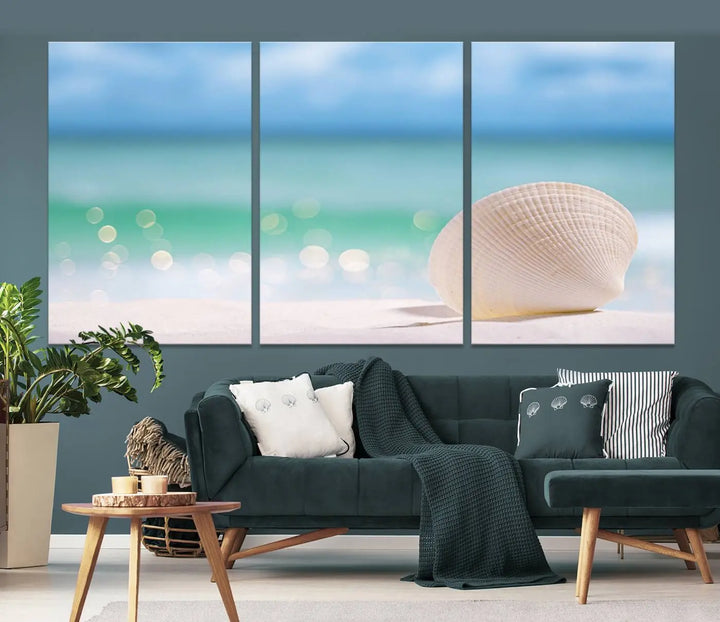 The "Seashell on The Beach Wall Art Canvas Print" features a triptych photo of a seashell on a sandy beach. This artwork is printed on gallery-wrapped, museum-quality canvas with a UV-protective coating.