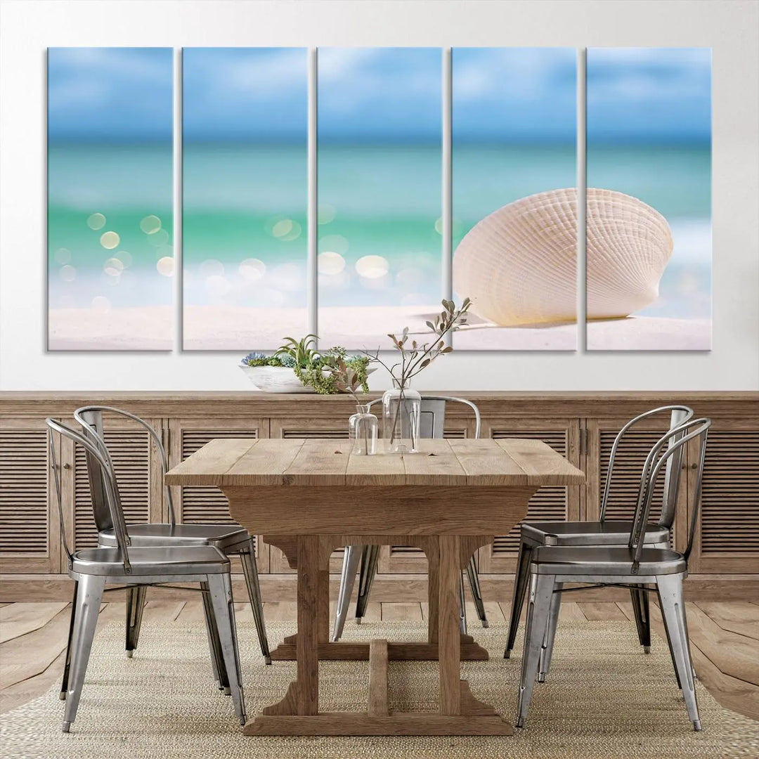 The "Seashell on The Beach Wall Art Canvas Print" features a triptych photo of a seashell on a sandy beach. This artwork is printed on gallery-wrapped, museum-quality canvas with a UV-protective coating.