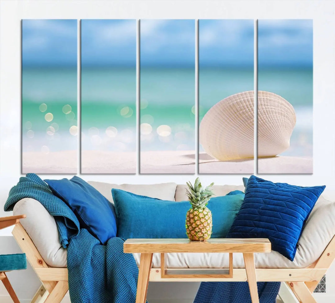 The "Seashell on The Beach Wall Art Canvas Print" features a triptych photo of a seashell on a sandy beach. This artwork is printed on gallery-wrapped, museum-quality canvas with a UV-protective coating.