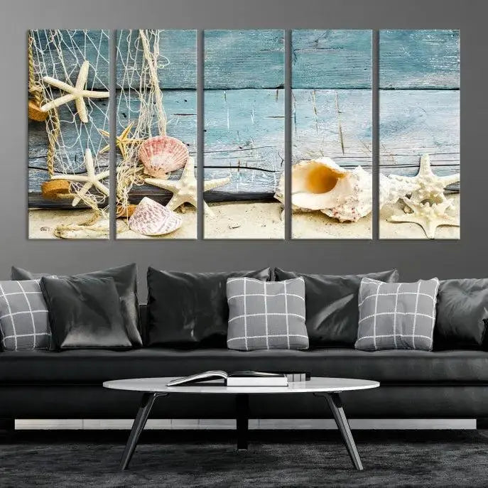 The beautiful three-panel canvas print, "Seashells on Rustic Wooden Background," features seashells and starfish against a blue wood background. The gallery-wrapped panels are coated with UV protection to ensure long-lasting vibrancy.