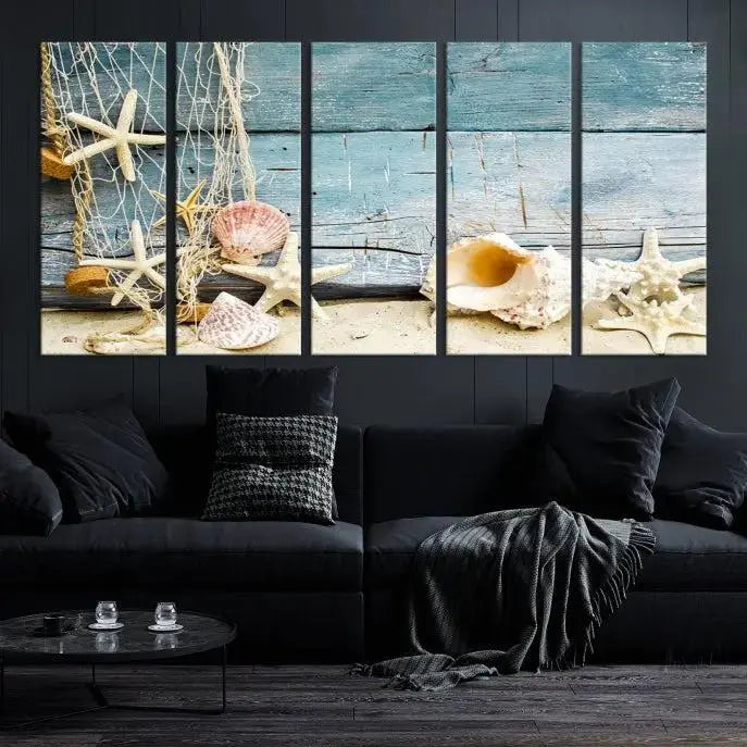 The beautiful three-panel canvas print, "Seashells on Rustic Wooden Background," features seashells and starfish against a blue wood background. The gallery-wrapped panels are coated with UV protection to ensure long-lasting vibrancy.