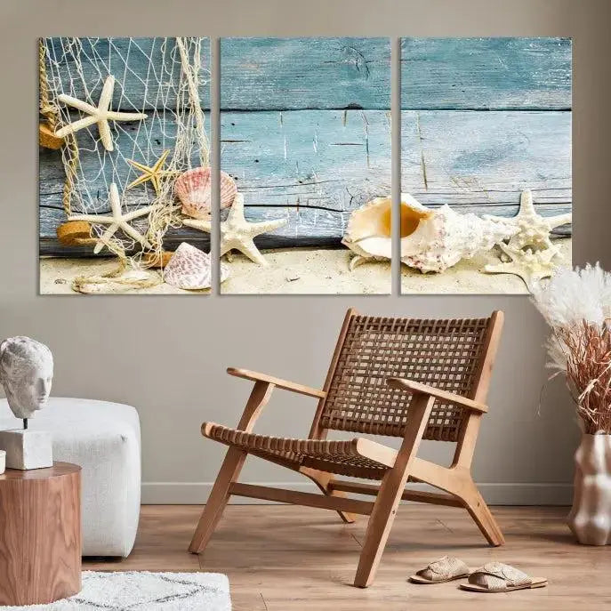 The beautiful three-panel canvas print, "Seashells on Rustic Wooden Background," features seashells and starfish against a blue wood background. The gallery-wrapped panels are coated with UV protection to ensure long-lasting vibrancy.