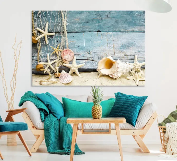 The beautiful three-panel canvas print, "Seashells on Rustic Wooden Background," features seashells and starfish against a blue wood background. The gallery-wrapped panels are coated with UV protection to ensure long-lasting vibrancy.