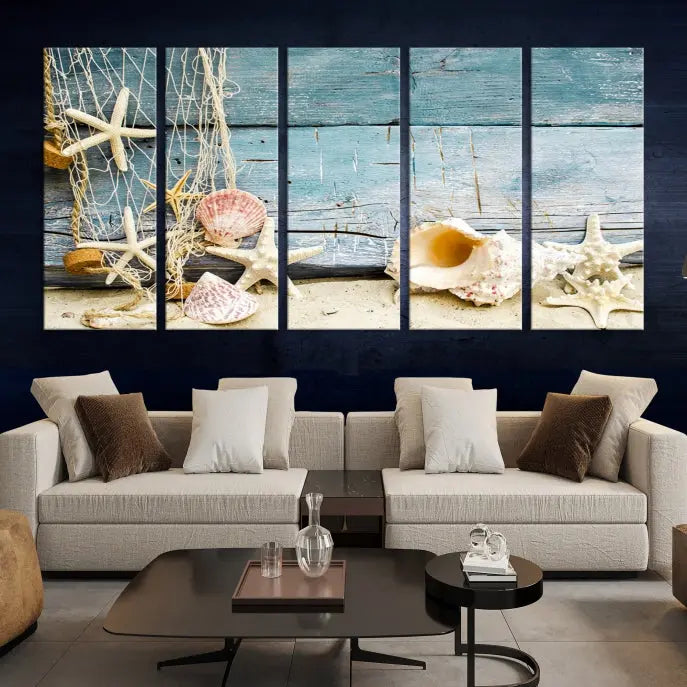 The beautiful three-panel canvas print, "Seashells on Rustic Wooden Background," features seashells and starfish against a blue wood background. The gallery-wrapped panels are coated with UV protection to ensure long-lasting vibrancy.