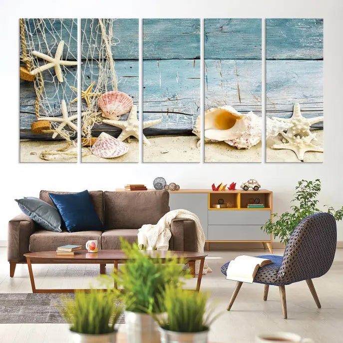 The beautiful three-panel canvas print, "Seashells on Rustic Wooden Background," features seashells and starfish against a blue wood background. The gallery-wrapped panels are coated with UV protection to ensure long-lasting vibrancy.