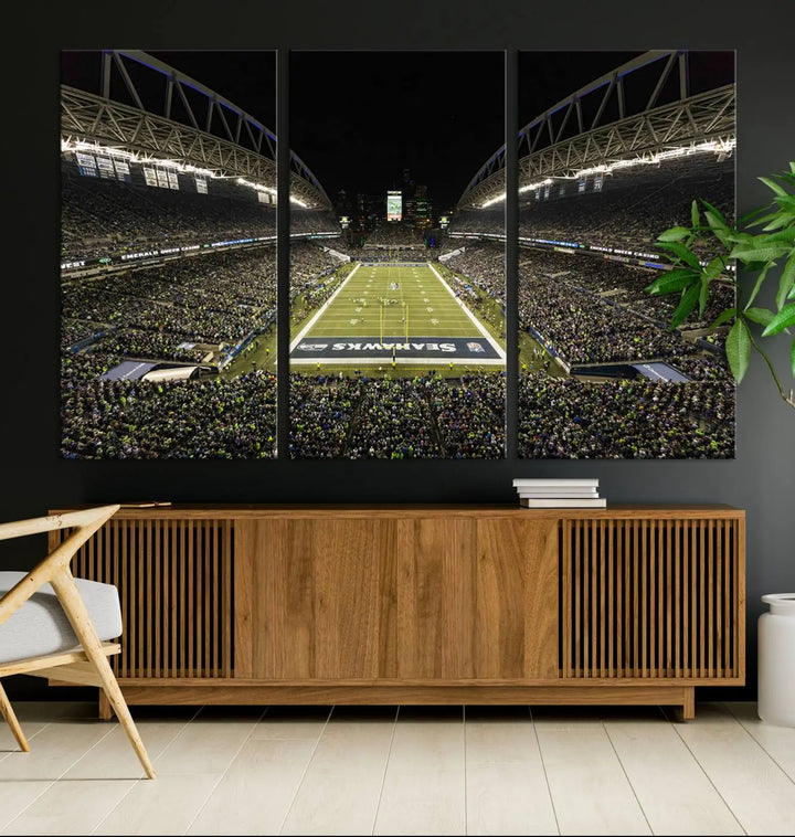 A three-panel wall art piece depicting the Seattle Seahawks' CenturyLink Field stadium adorns the space. This premium canvas, handmade in the USA, showcases quality and captures the fervor of sports enthusiasts.