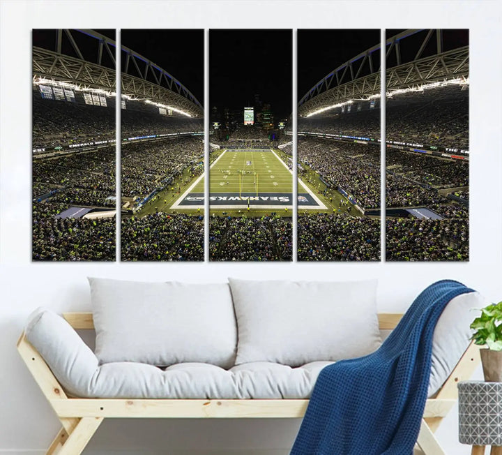 A three-panel wall art piece depicting the Seattle Seahawks' CenturyLink Field stadium adorns the space. This premium canvas, handmade in the USA, showcases quality and captures the fervor of sports enthusiasts.