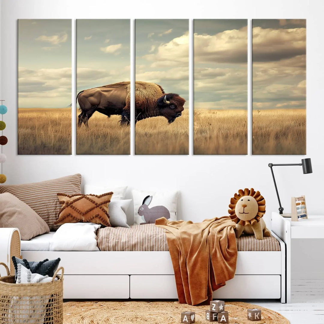 The Sepia American Bison Wall Art Print, a Western canvas print, depicts a bison standing in a grassy field beneath a cloudy sky. This high-resolution museum-quality triptych wall art is ideal for farmhouse wall decor.